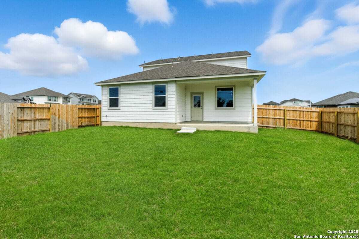 1896 Split Rock Road New Braunfels, TX 78130 - Photo 22 of 22 a view of a house with a yard
