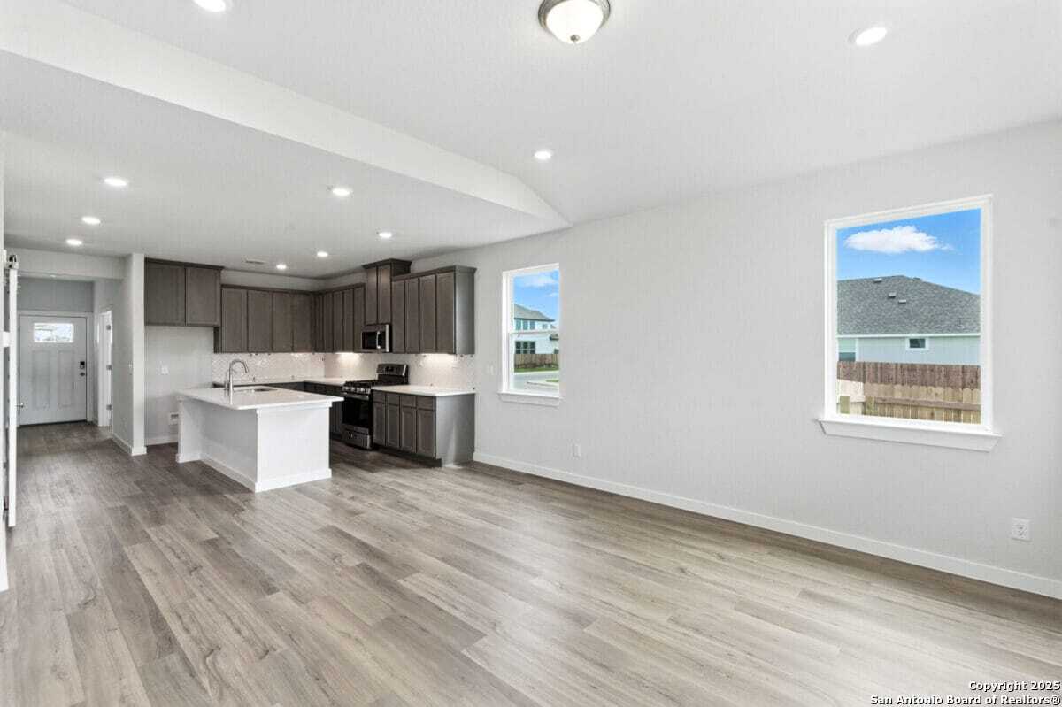 1896 Split Rock Road New Braunfels, TX 78130 - Photo 9 of 22 a kitchen with a sink and cabinets