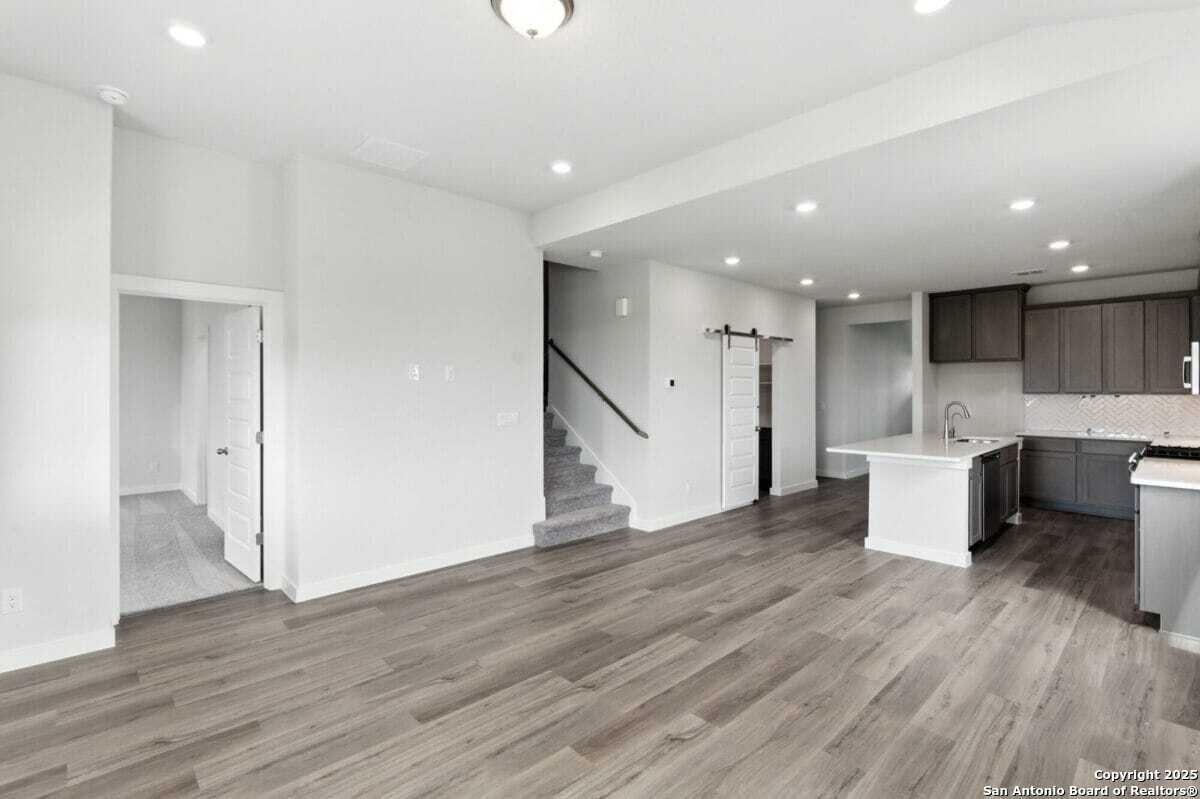 1896 Split Rock Road New Braunfels, TX 78130 - Photo 10 of 22 a view of kitchen with wooden floor and electronic appliances