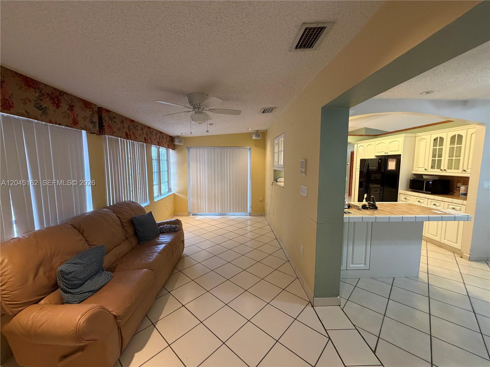 3262 Southwest 139th Place Miami, FL 33175 - Photo 10 of 36 a living room with furniture and a couch