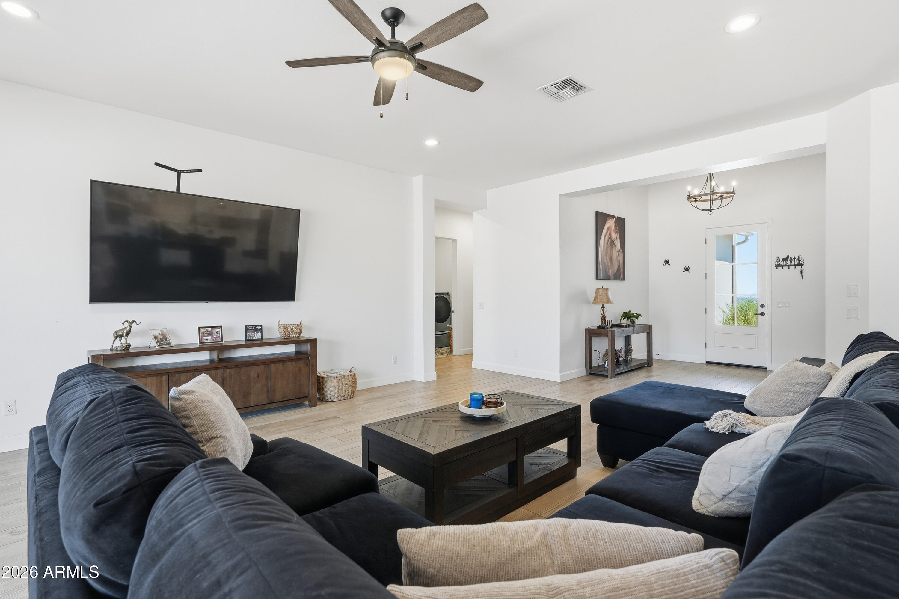 10464 East Magnolia Road Gold Canyon, AZ 85118 - Photo 12 of 77 a living room with furniture and a flat screen tv