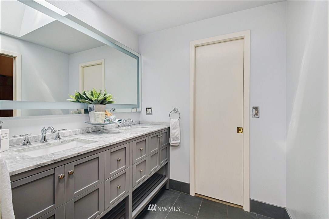 23901 23rd Drive Southeast Bothell, WA 98021 - Photo 18 of 27 a bathroom with a granite countertop sink and a mirror