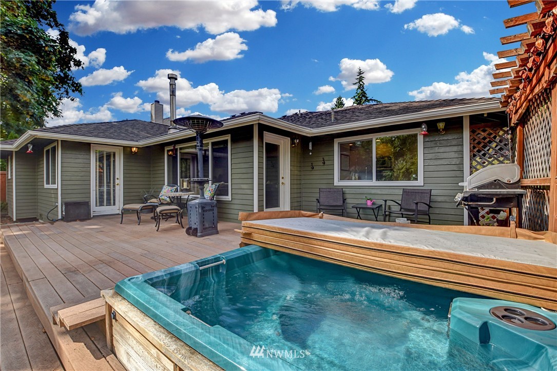 23901 23rd Drive Southeast Bothell, WA 98021 - Photo 24 of 27 a view of a house with pool and chairs