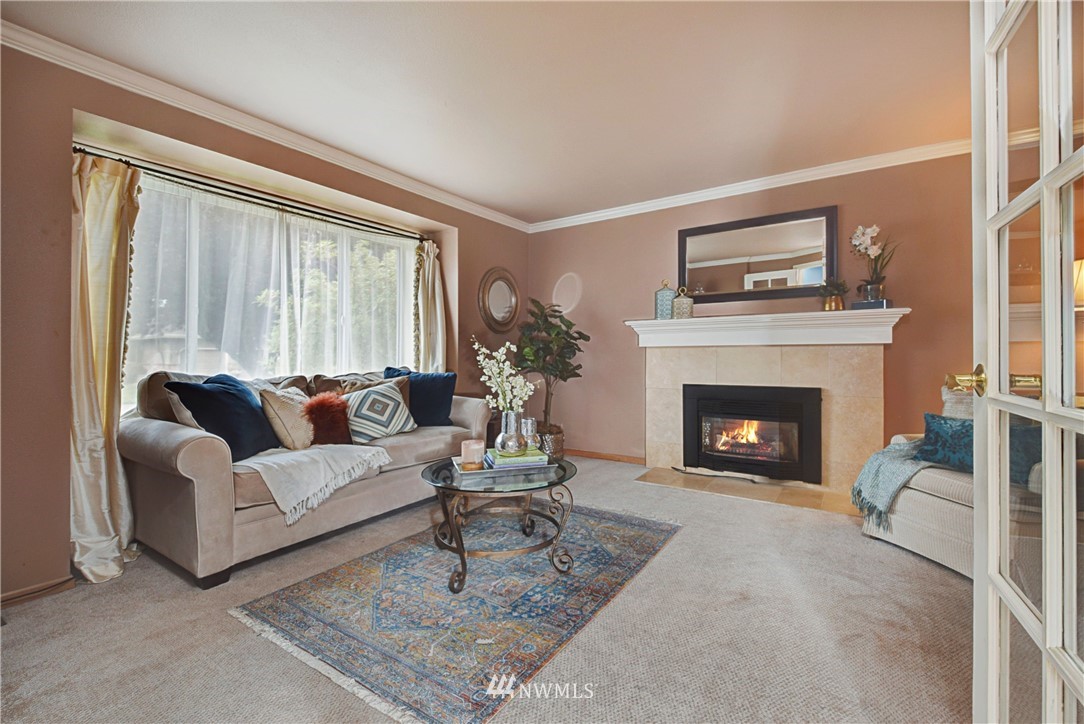 23901 23rd Drive Southeast Bothell, WA 98021 - Photo 5 of 27 a living room with furniture and a fireplace
