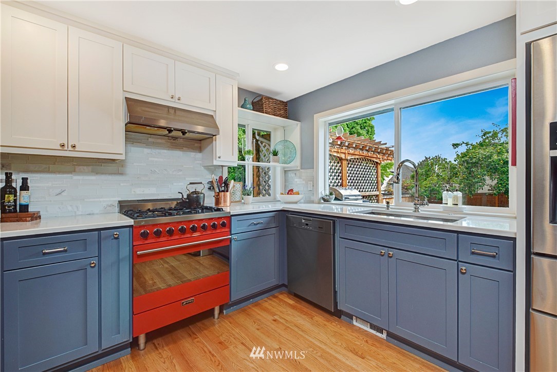 23901 23rd Drive Southeast Bothell, WA 98021 - Photo 9 of 27 a kitchen with stainless steel appliances granite countertop a stove a sink and a refrigerator