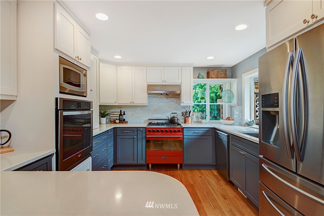 23901 23rd Drive Southeast Bothell, WA 98021 - Photo 10 of 27 a kitchen with stainless steel appliances granite countertop a refrigerator sink and stove