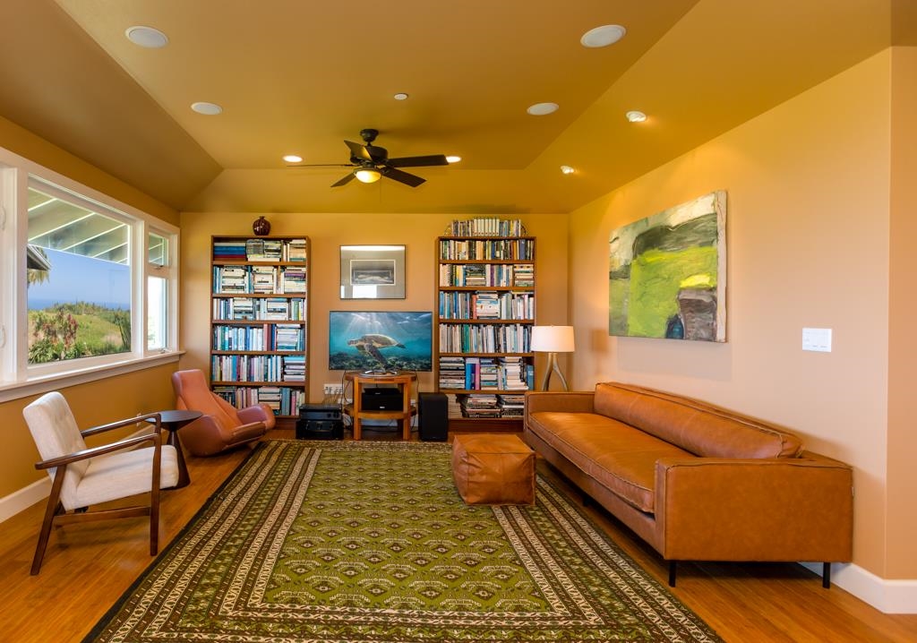 130 North Honokala Road Haiku, HI 96708 - Photo 13 of 30 a living room with furniture a rug and a large window