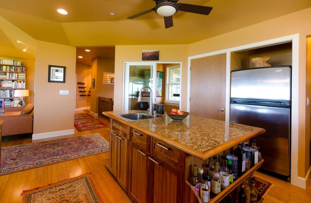 130 North Honokala Road Haiku, HI 96708 - Photo 14 of 30 a kitchen with stainless steel appliances granite countertop a sink and a refrigerator