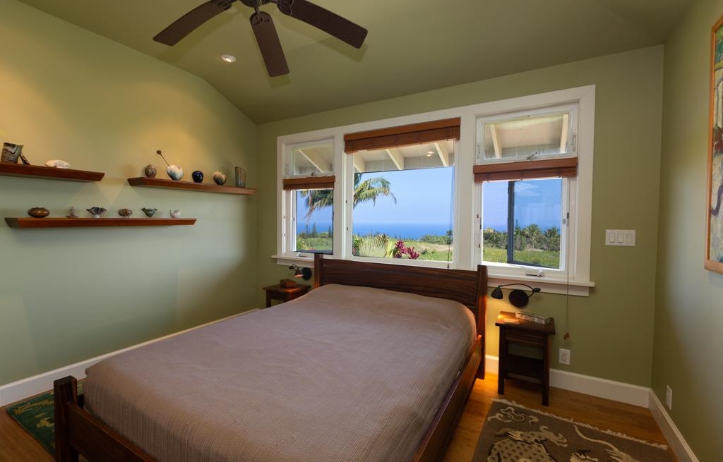 130 North Honokala Road Haiku, HI 96708 - Photo 22 of 30 a bed sitting in a bedroom next to a window
