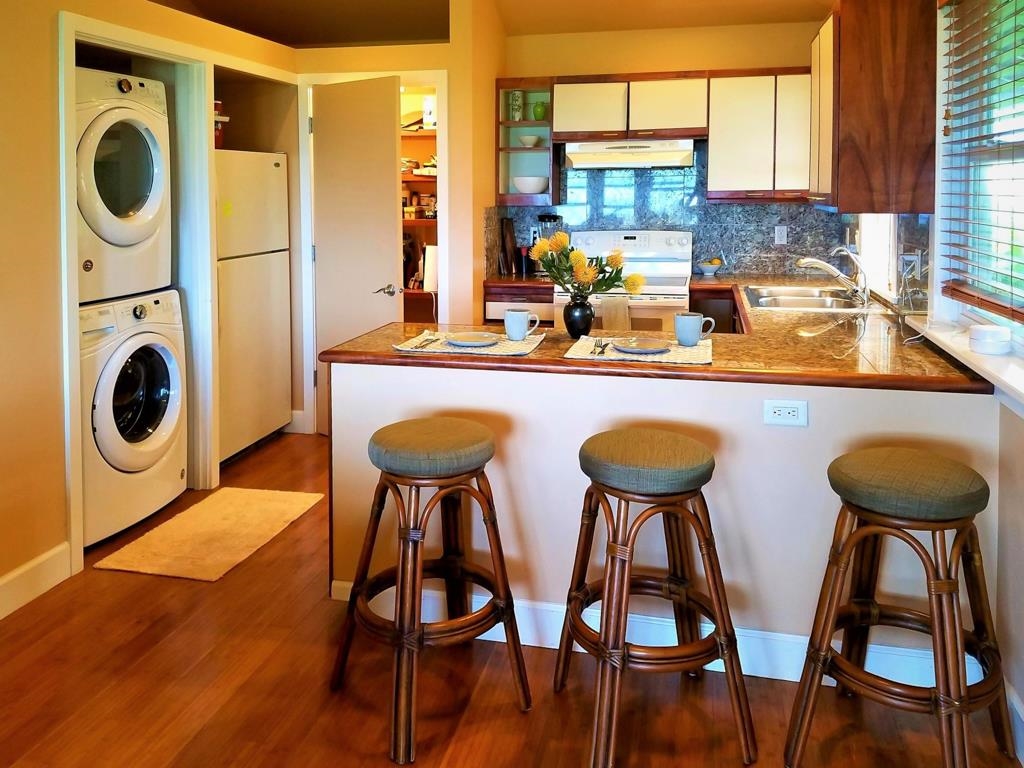 130 North Honokala Road Haiku, HI 96708 - Photo 28 of 30 a kitchen with chairs and wooden floor