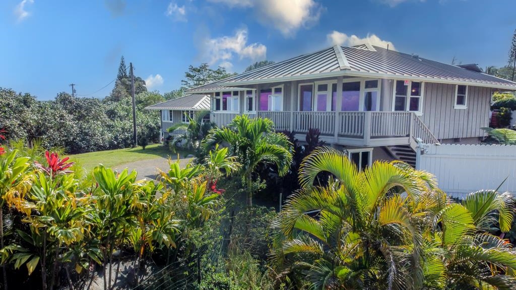 130 North Honokala Road Haiku, HI 96708 - Photo 3 of 30 a flower plants in front of a house