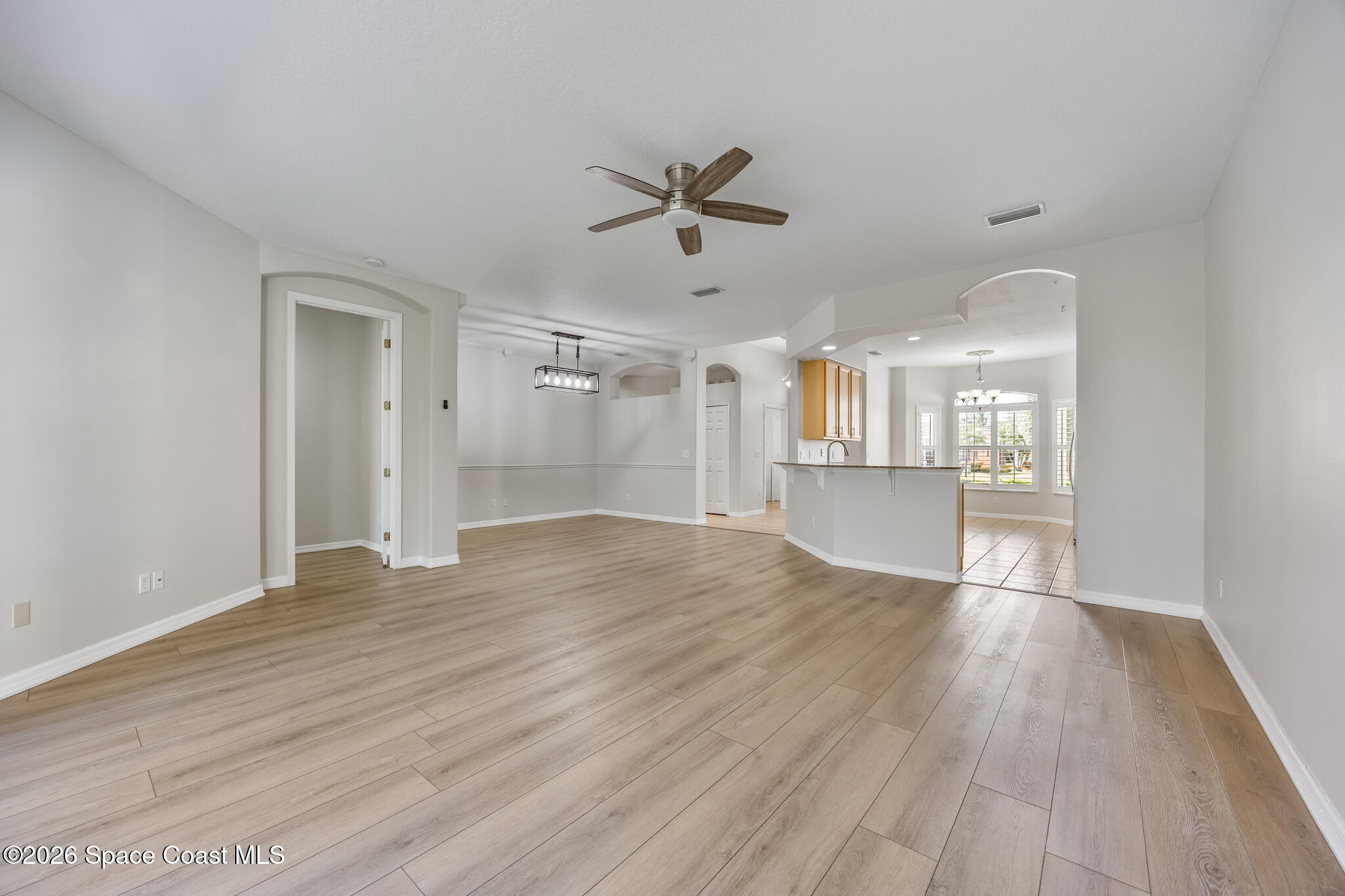 Undisclosed Address Melbourne, FL 32940 - Photo 11 of 26 a view of an empty room with window and wooden floor