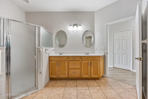 a view of bathroom with dual sinks