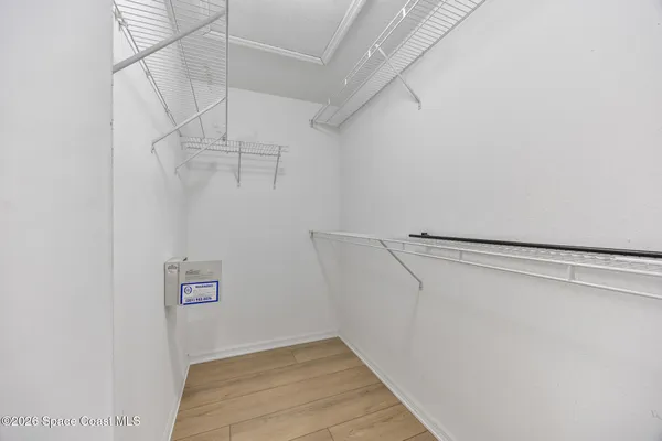 a view of a room with racks on the wall