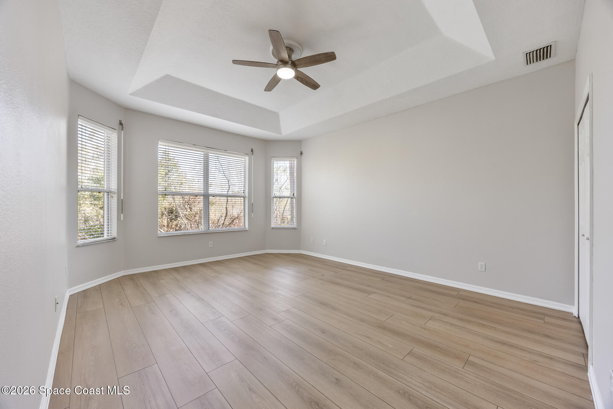 Undisclosed Address Melbourne, FL 32940 - Photo 17 of 26 wooden floor in an empty room with a window