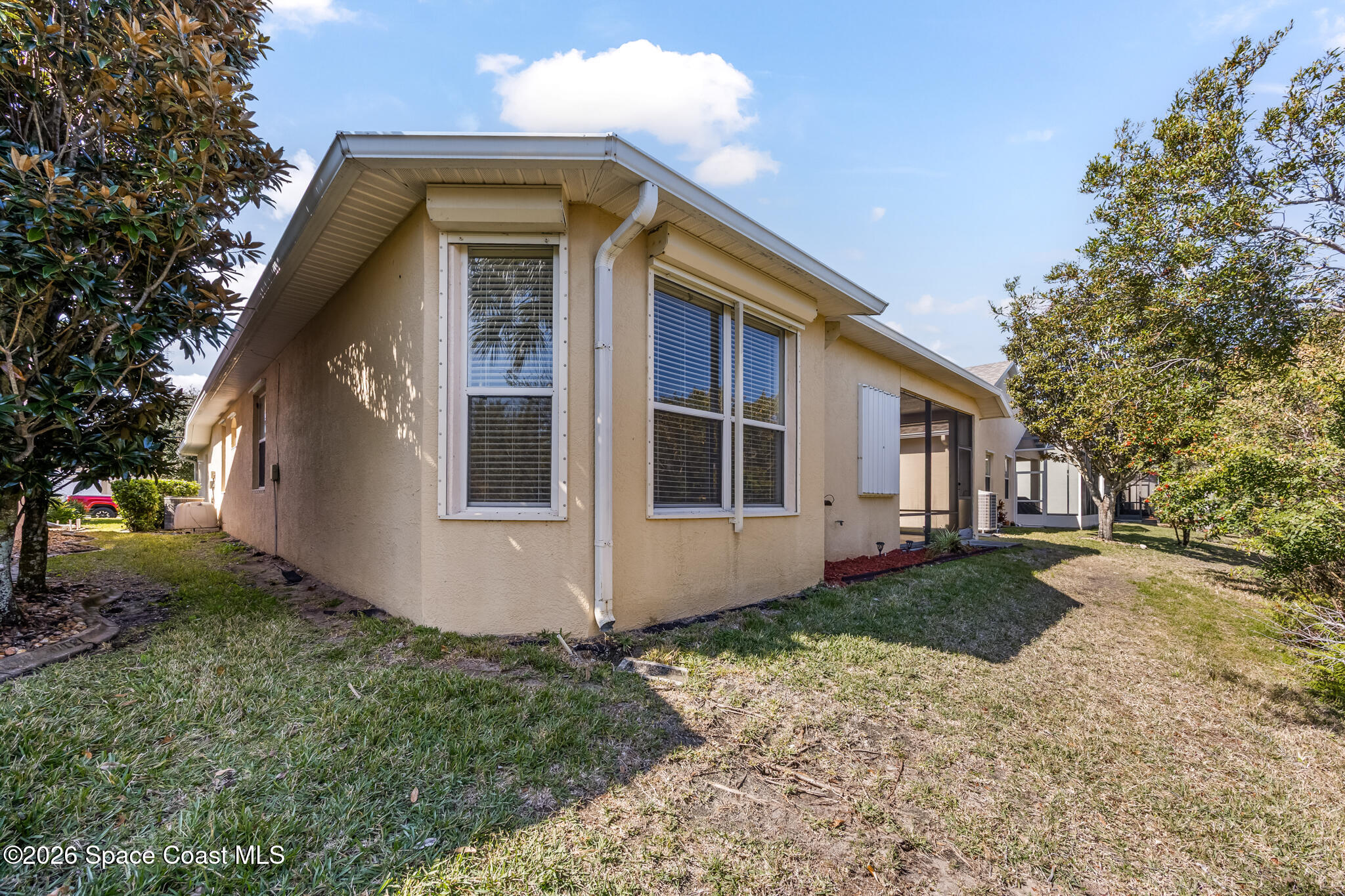 Undisclosed Address Melbourne, FL 32940 - Photo 23 of 26 a front view of a house with garden