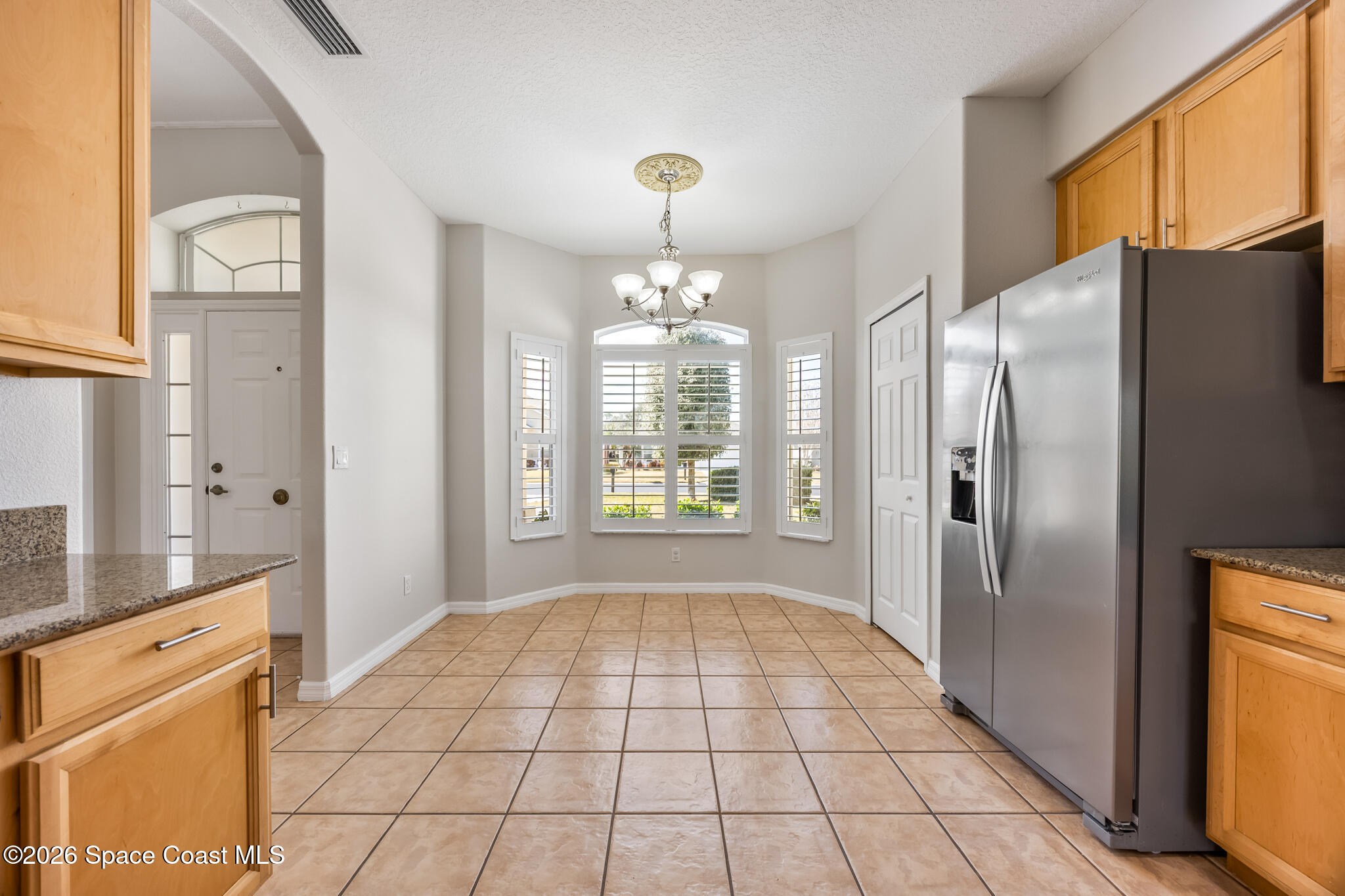 Undisclosed Address Melbourne, FL 32940 - Photo 7 of 26 a view of a kitchen with windows refrigerator and a sink