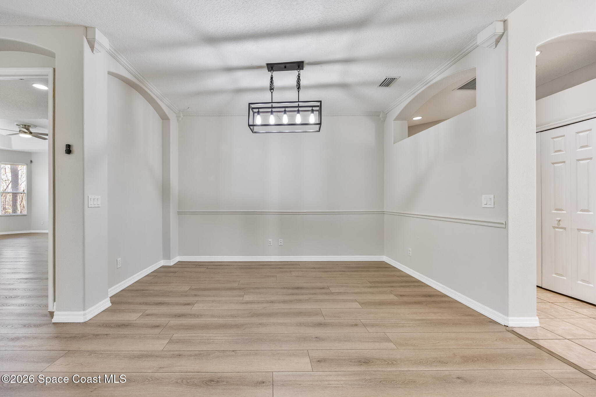 Undisclosed Address Melbourne, FL 32940 - Photo 9 of 26 a view of a room with wooden floor