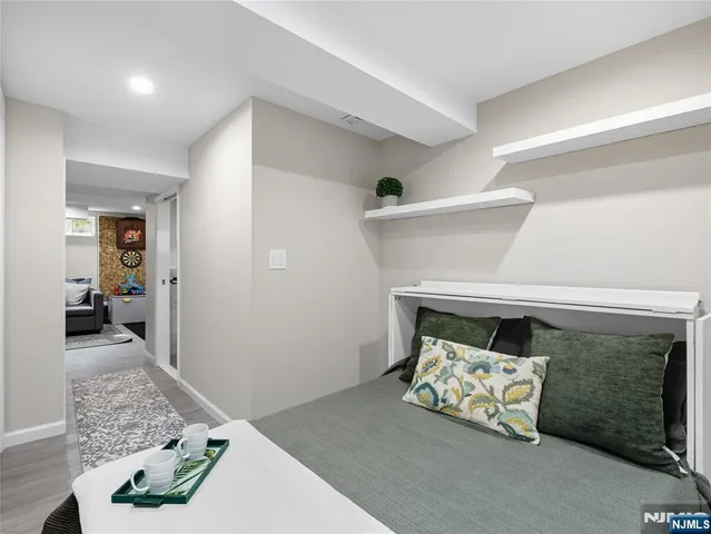 a bedroom with a bed and a couch