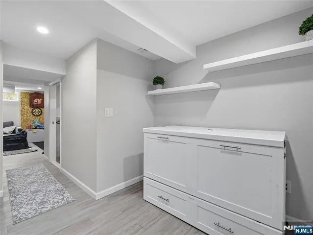 a view of storage and utility room with closet