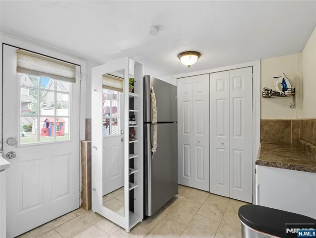 a bathroom with a shower and a sink
