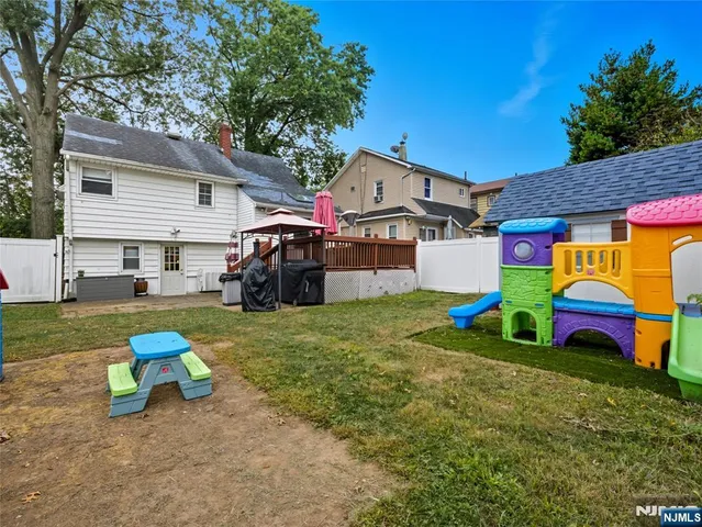 a view of a house with a back yard