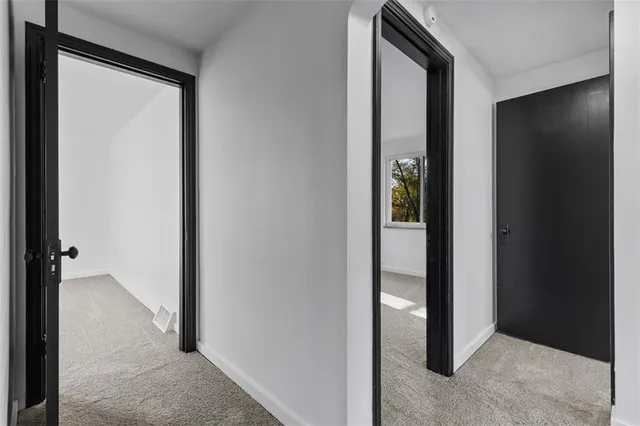 a view of a livingroom from a hallway