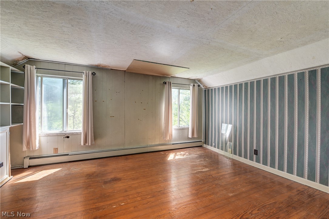 343 Bellus Road Hinckley, OH 44233 - Photo 31 of 49 Upstairs bedroom 1 with hardwood wood flooring.