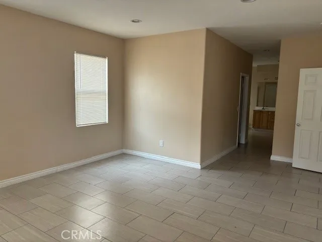 a spacious bathroom with a tub sink shower and mirror