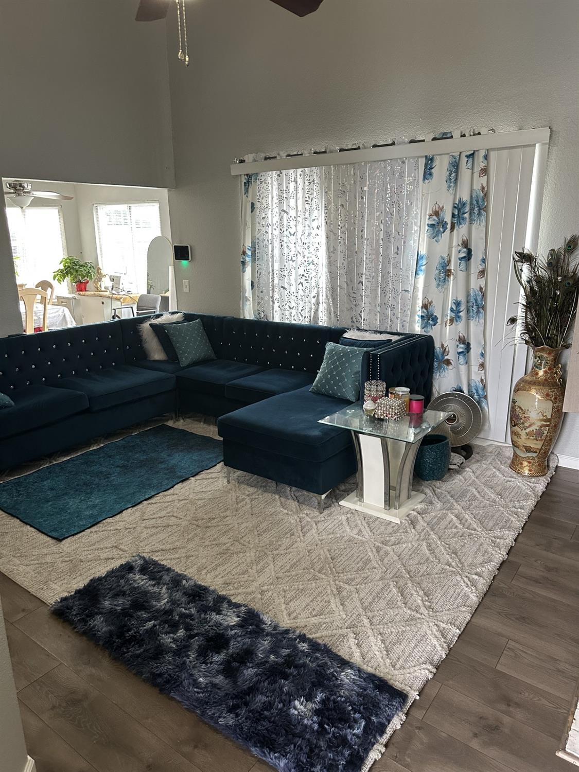 5723 Larcom Lane Stockton, CA 95210 - Photo 11 of 22 a living room with furniture rug and window