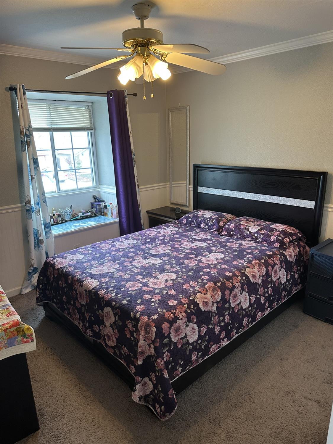 5723 Larcom Lane Stockton, CA 95210 - Photo 17 of 22 a bed sitting in a bedroom next to a window