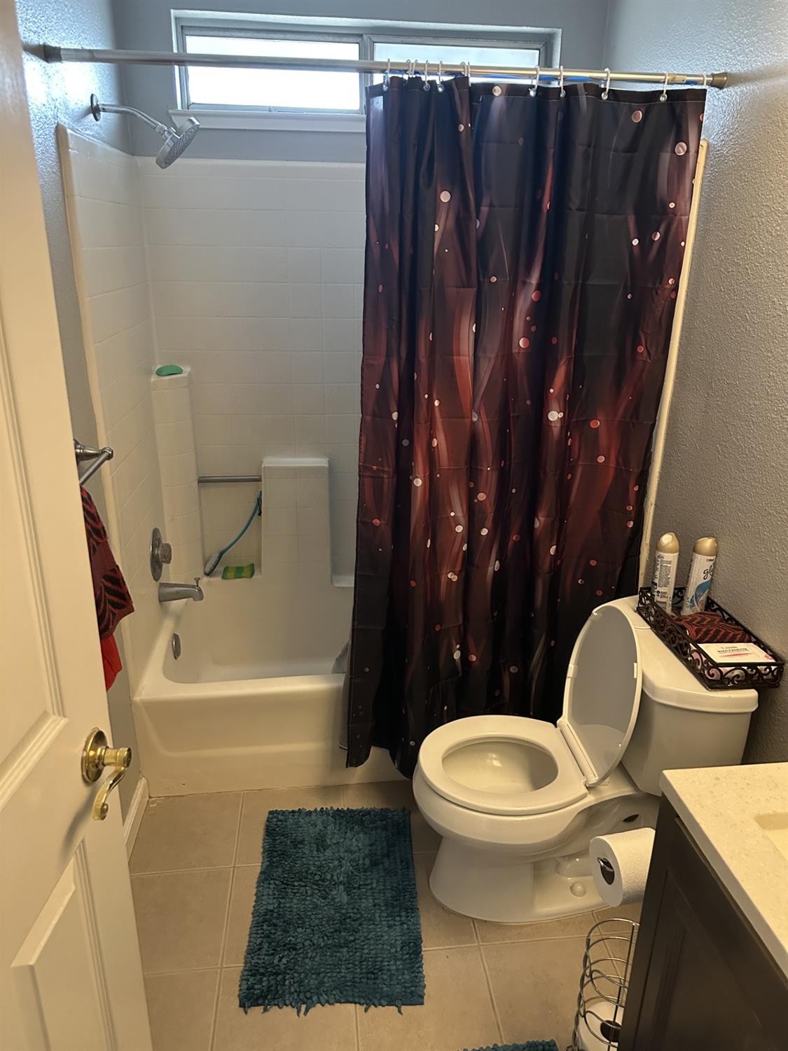 5723 Larcom Lane Stockton, CA 95210 - Photo 19 of 22 a bathroom with a toilet and a shower