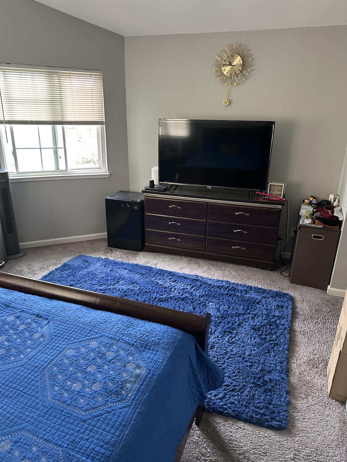 5723 Larcom Lane Stockton, CA 95210 - Photo 20 of 22 a living room with a flat screen tv and a window