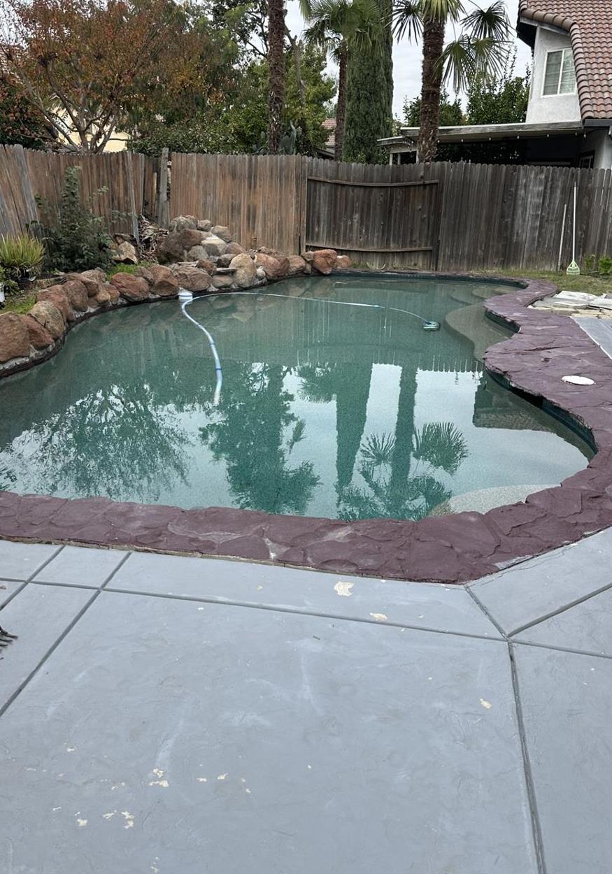 5723 Larcom Lane Stockton, CA 95210 - Photo 22 of 22 a view of swimming pool with a patio