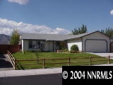 567 Yellow Jacket Road Dayton, NV 89403 - Photo 1 of 6 a front view of a house having a yard