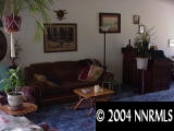567 Yellow Jacket Road Dayton, NV 89403 - Photo 6 of 6 a living room with furniture and a wooden floor
