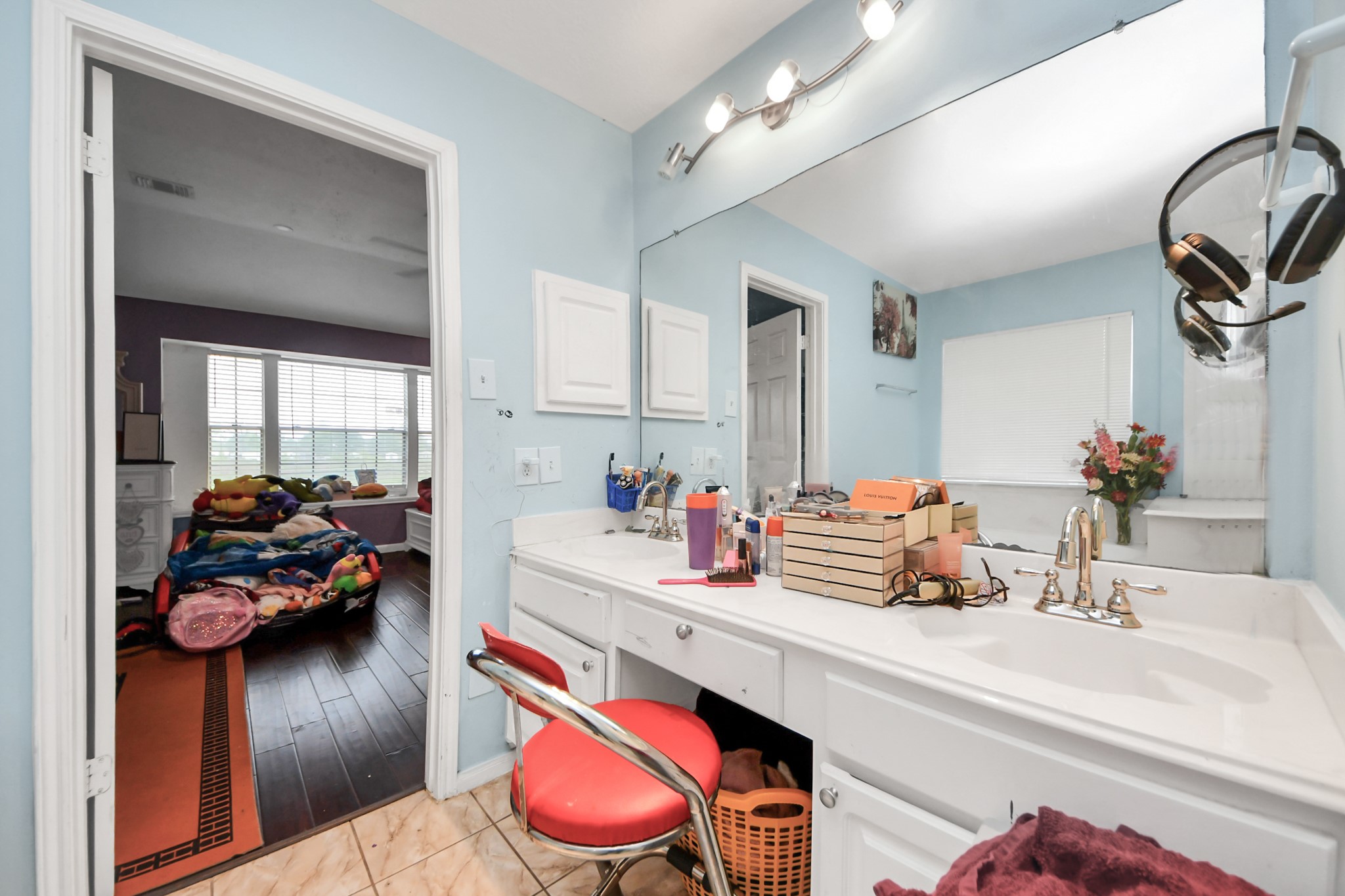 14119 Renn Road Houston, TX 77083 - Photo 20 of 43 a bathroom with a sink and a mirror