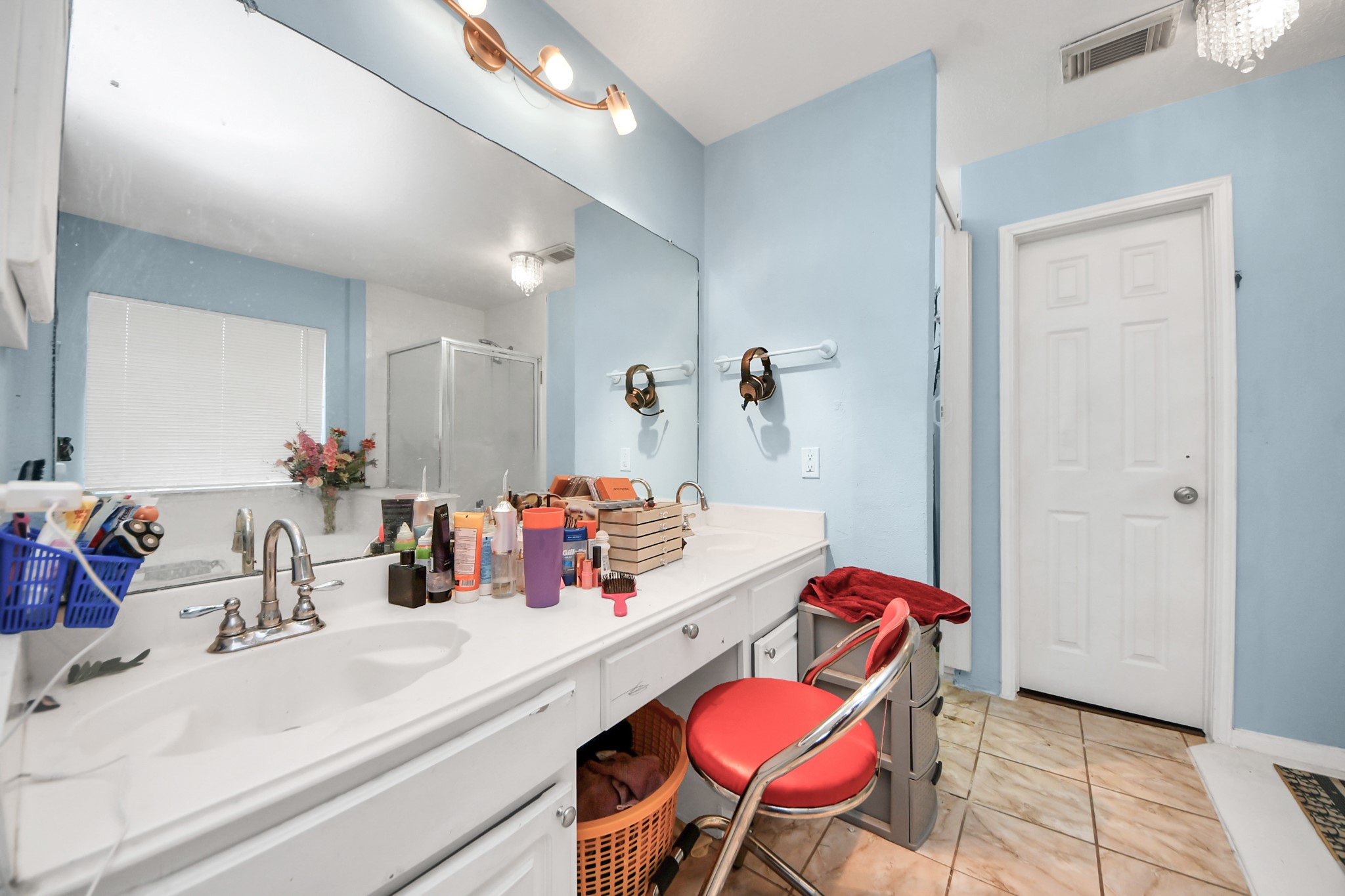 14119 Renn Road Houston, TX 77083 - Photo 21 of 43 a bathroom with a sink vanity mirror and toilet