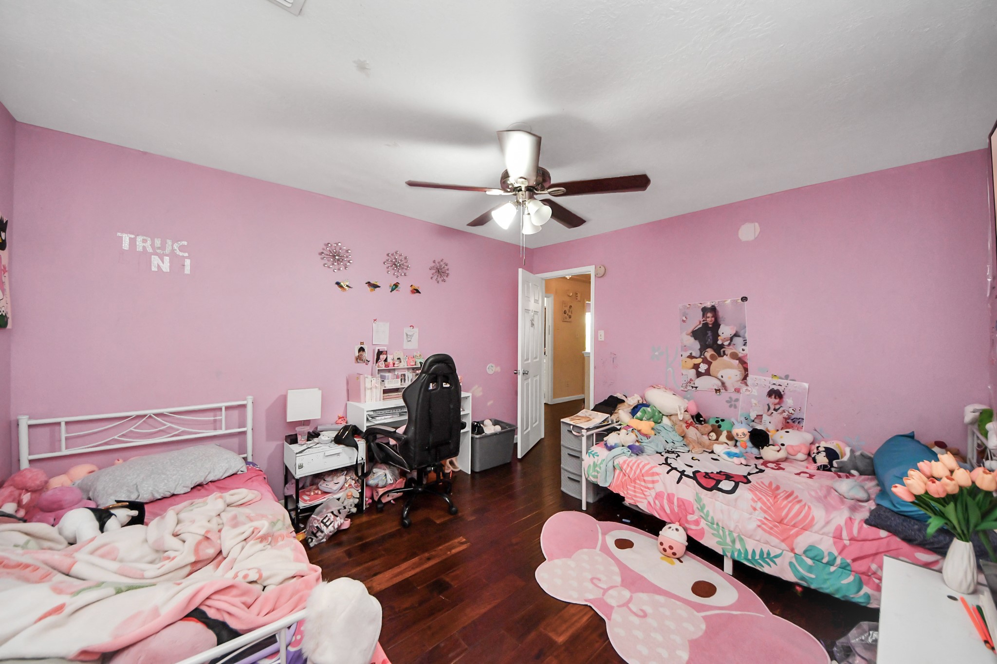 14119 Renn Road Houston, TX 77083 - Photo 25 of 43 a bed room with a bed and a chair
