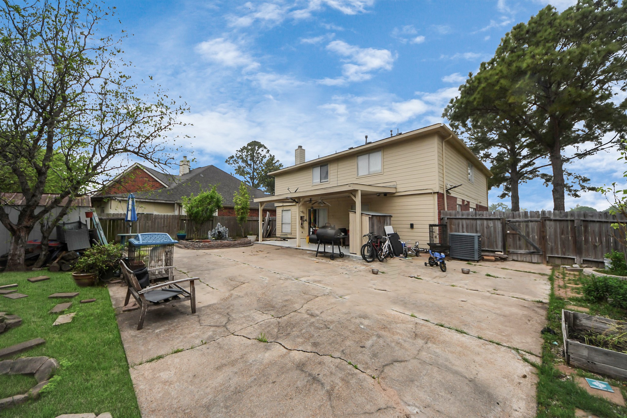 14119 Renn Road Houston, TX 77083 - Photo 32 of 43 a view of a house with a patio