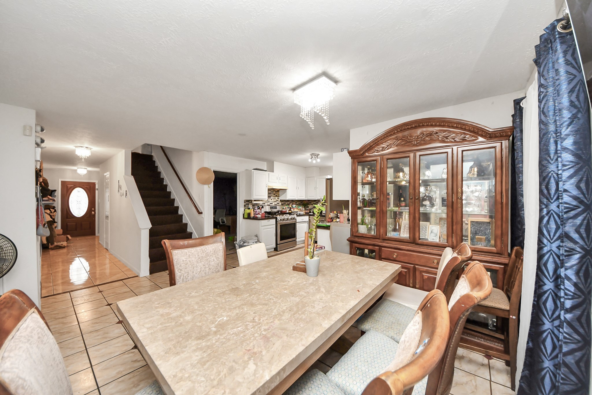 14119 Renn Road Houston, TX 77083 - Photo 6 of 43 a living room with furniture a rug and a large window