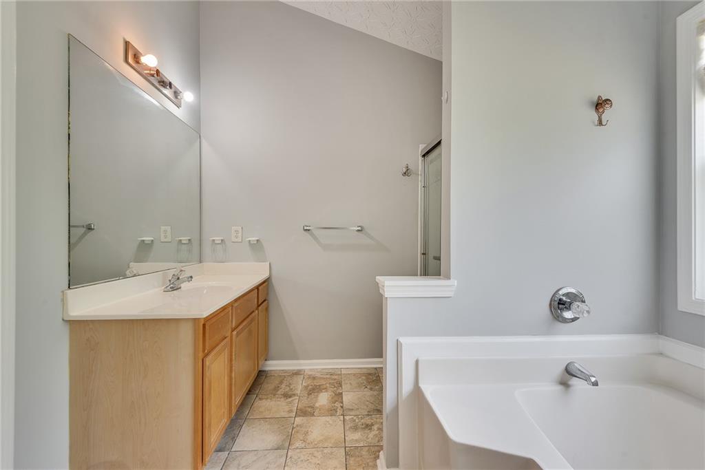 3337 Baymount Way Lawrenceville, GA 30043 - Photo 31 of 47 a bathroom with a sink and a tub