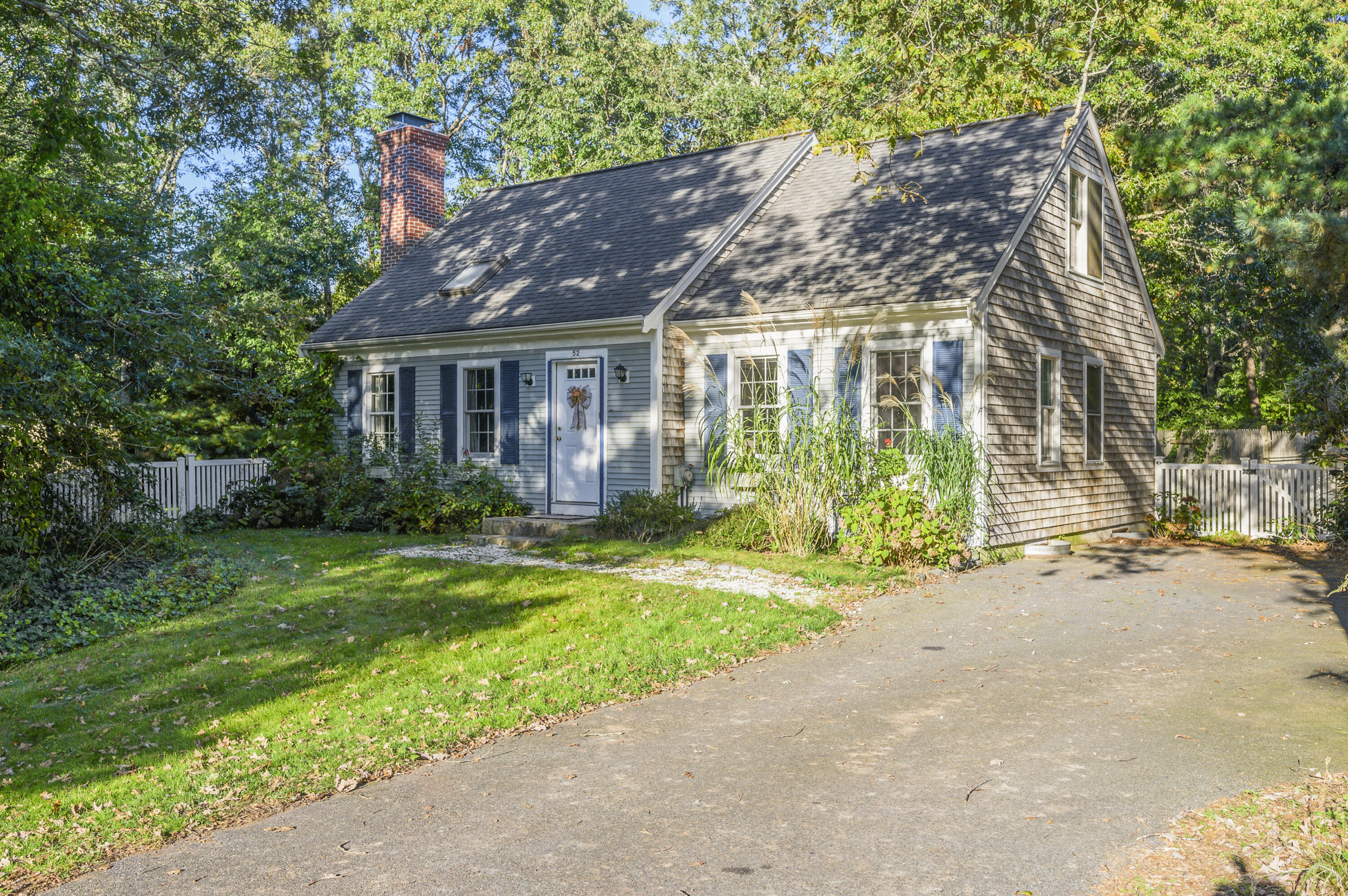 52 Zeno Crocker Road Centerville, MA 02632 - Photo 1 of 20 front view of house with a yard