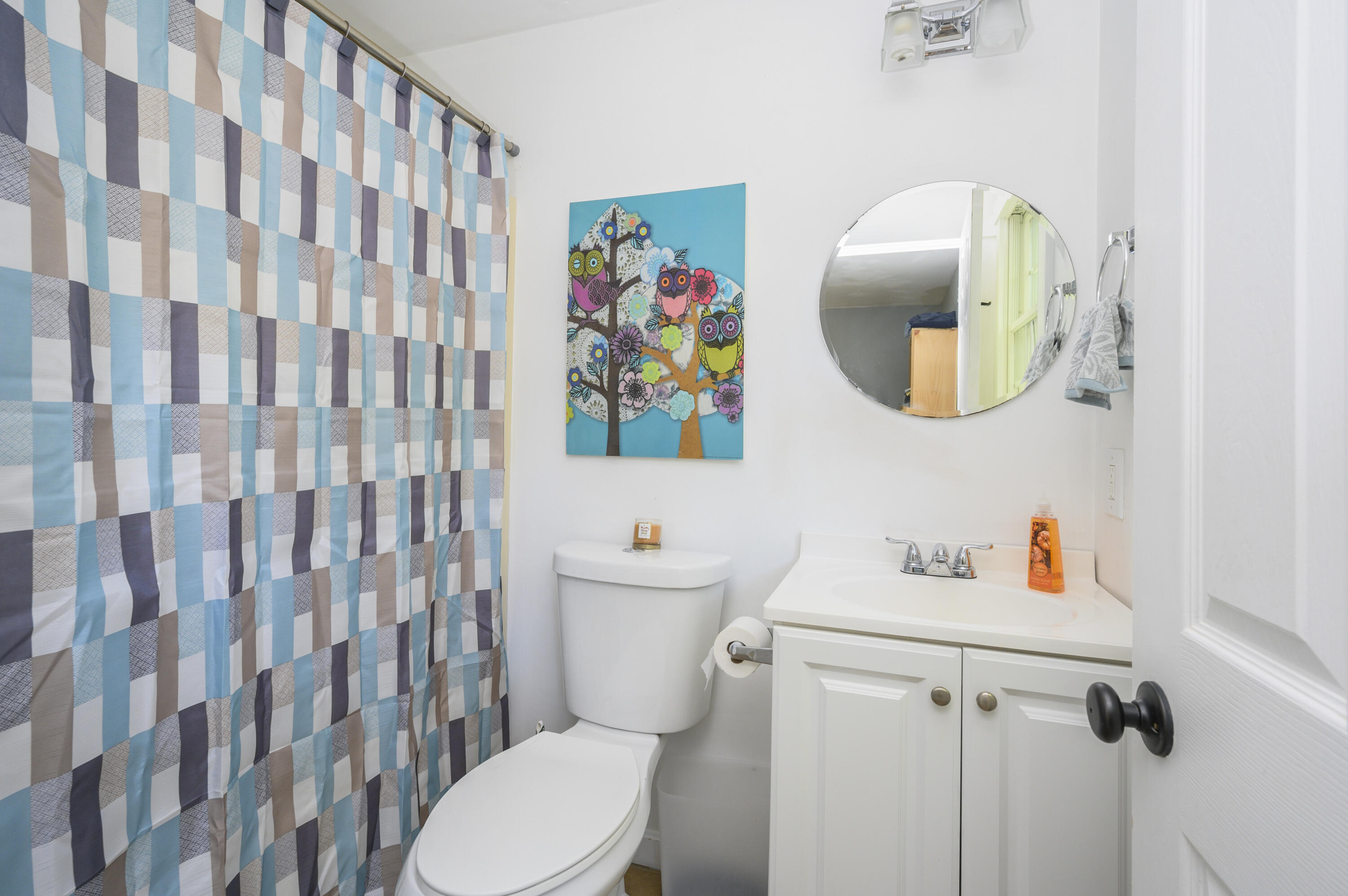 52 Zeno Crocker Road Centerville, MA 02632 - Photo 11 of 20 a white toilet sitting next to a bathroom sink