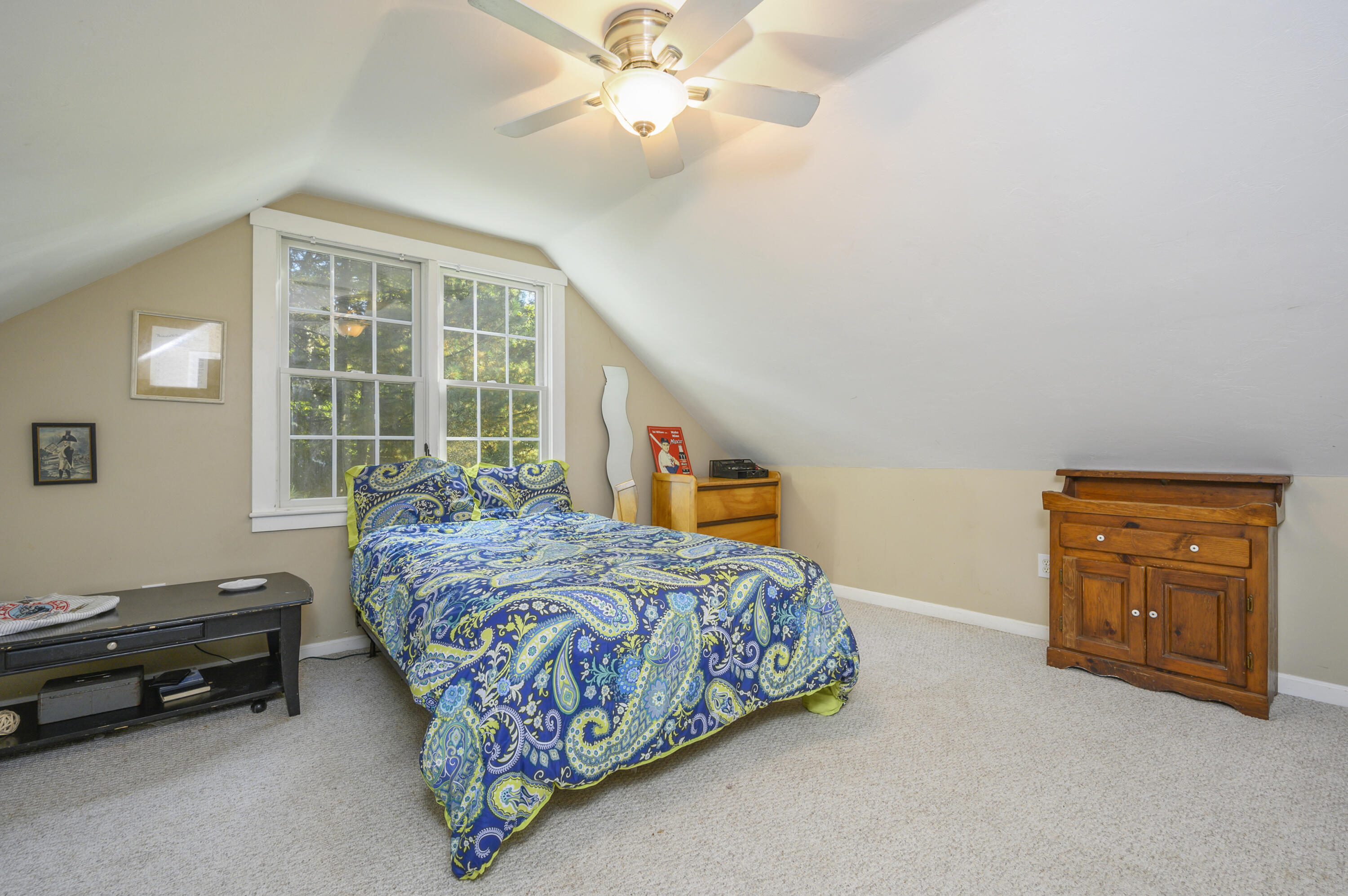52 Zeno Crocker Road Centerville, MA 02632 - Photo 14 of 20 a bedroom with a bed and a chandelier