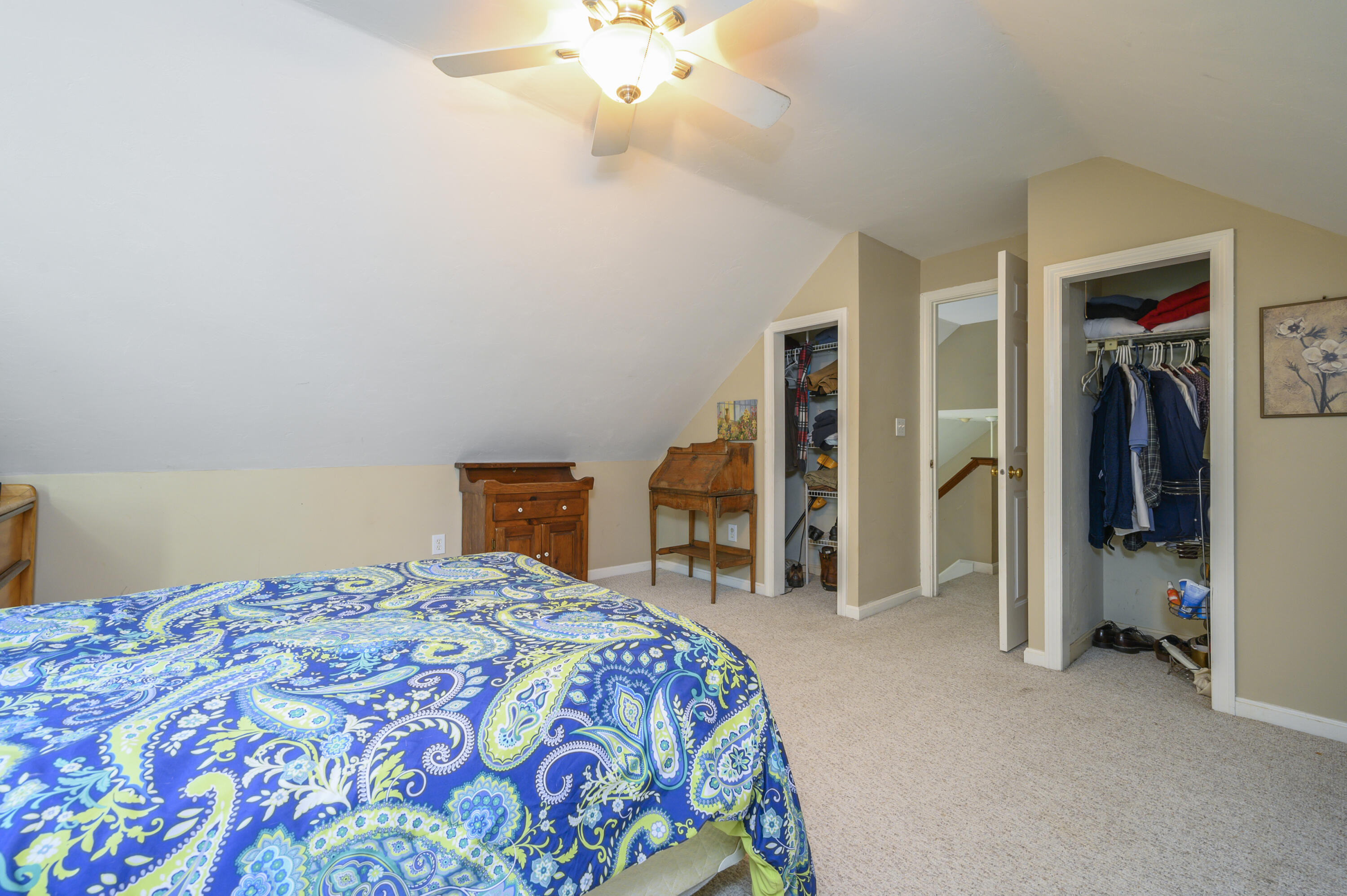 52 Zeno Crocker Road Centerville, MA 02632 - Photo 15 of 20 a bedroom with a bed and a chandelier