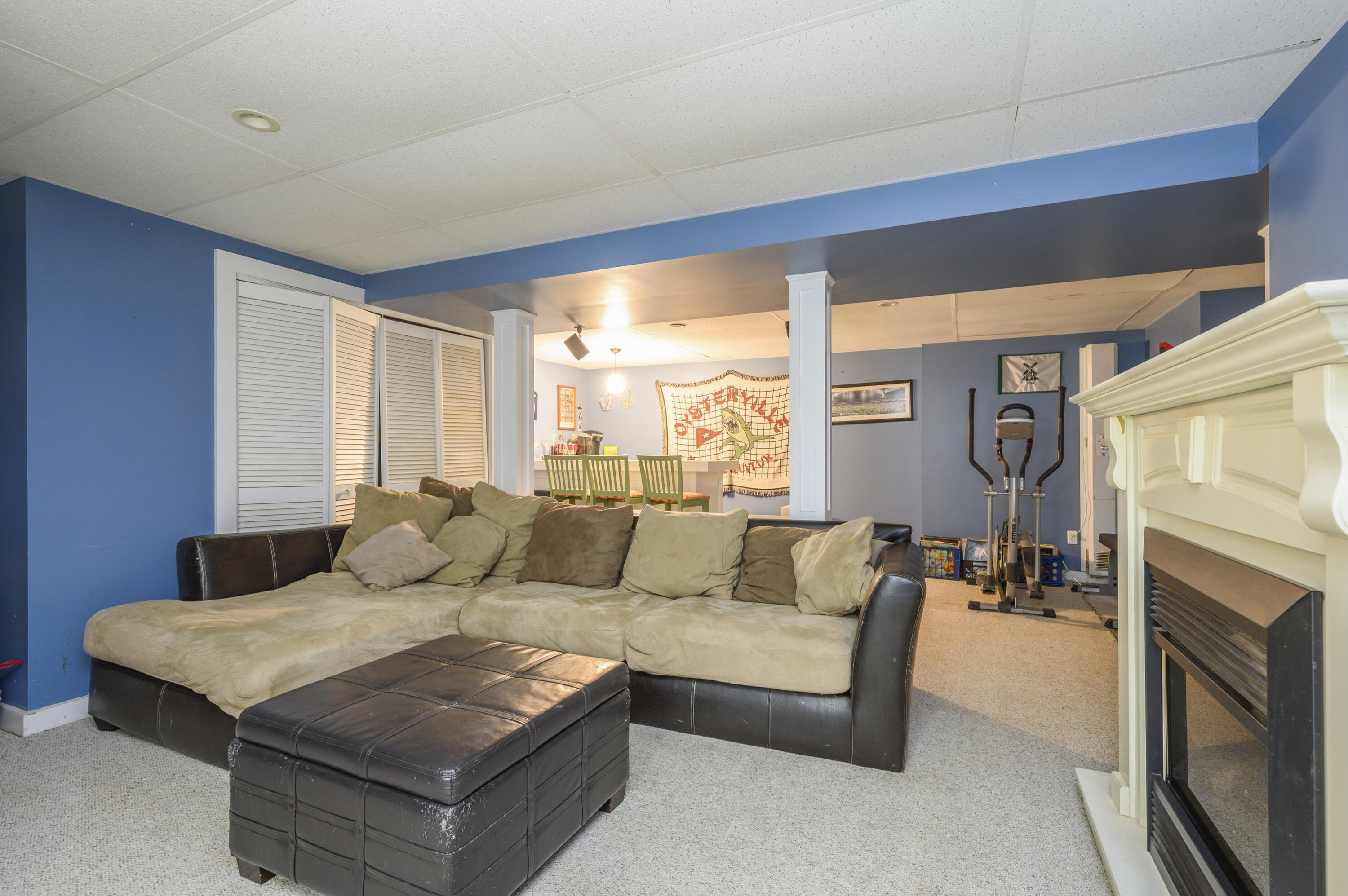 52 Zeno Crocker Road Centerville, MA 02632 - Photo 17 of 20 a living room with furniture and a fireplace
