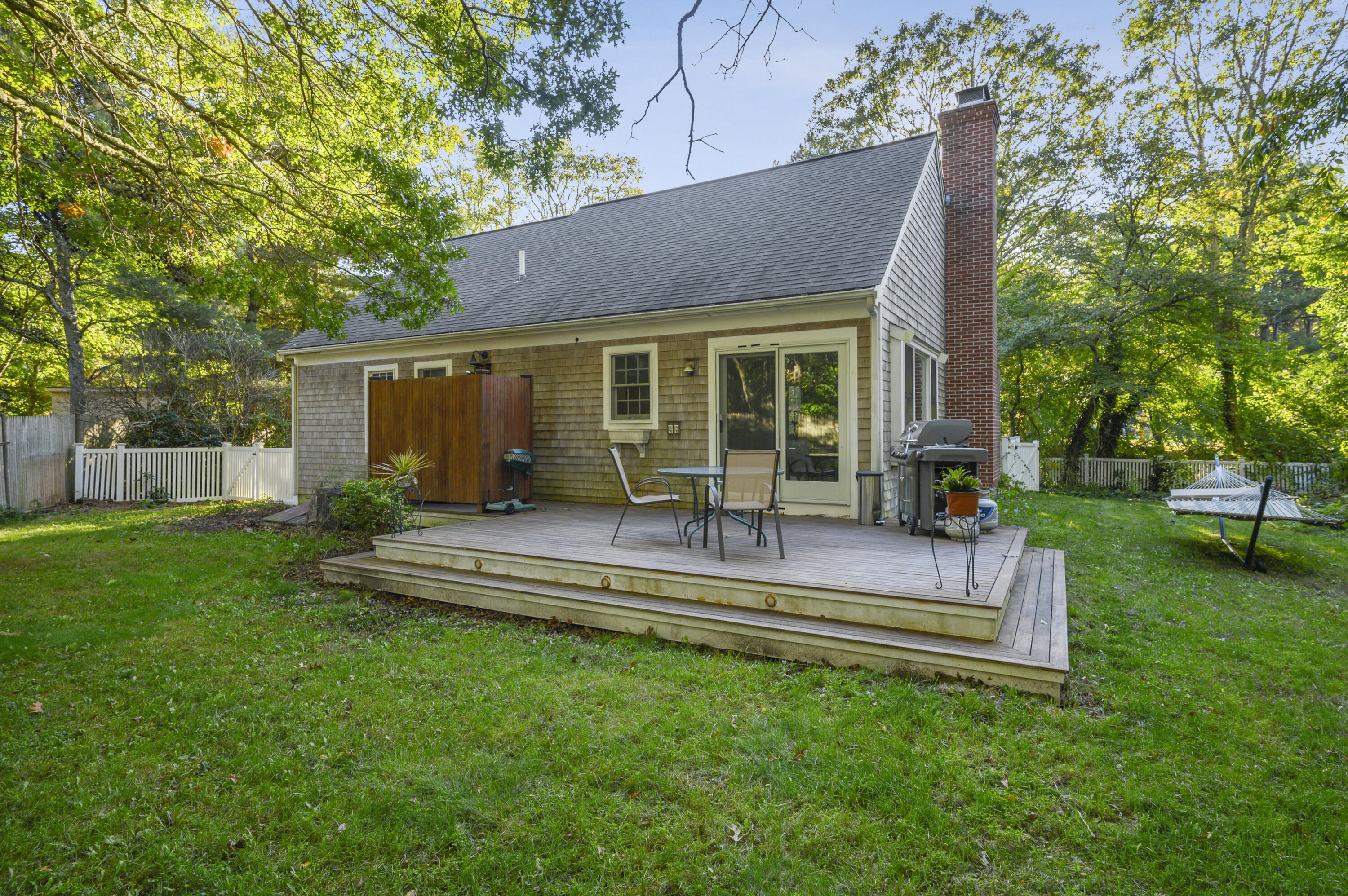 52 Zeno Crocker Road Centerville, MA 02632 - Photo 19 of 20 a view of a house with a yard porch and sitting area