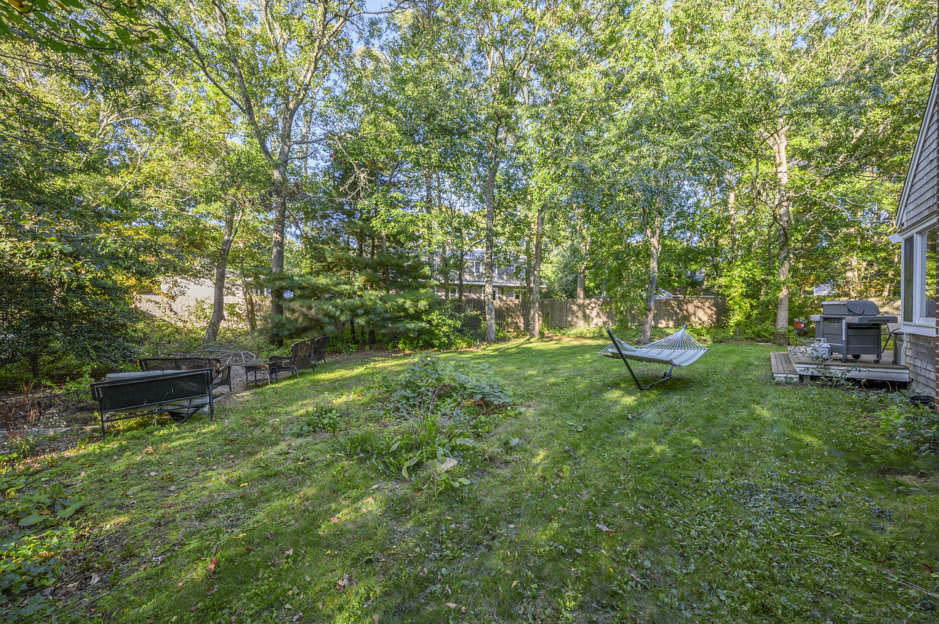 52 Zeno Crocker Road Centerville, MA 02632 - Photo 20 of 20 a view of a backyard with sitting area