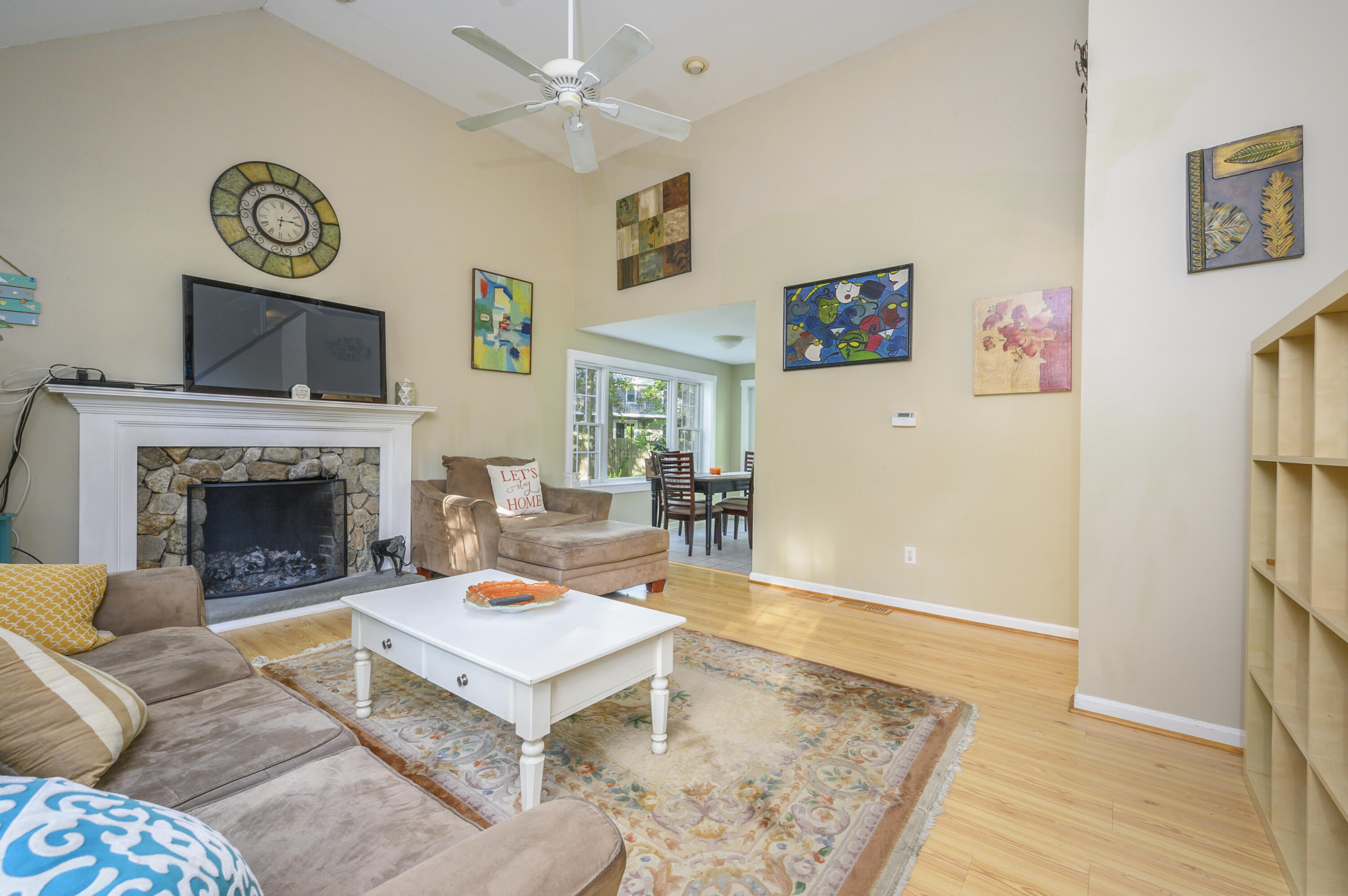 52 Zeno Crocker Road Centerville, MA 02632 - Photo 3 of 20 a living room with furniture a flat screen tv and a fireplace